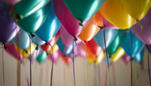 selective focus photography of assorted-color balloons